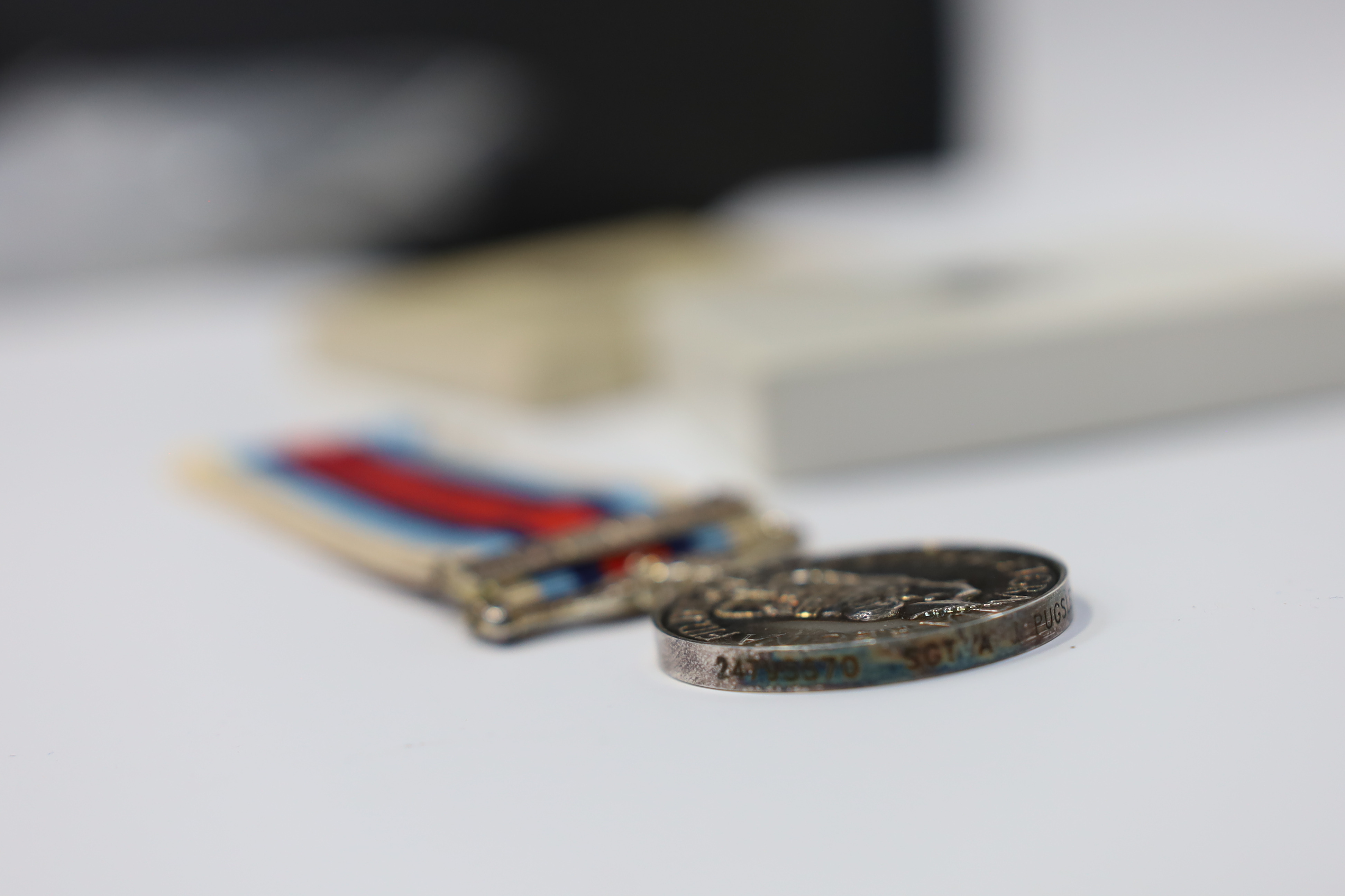 An ERII Operational Service Medal for Afghanistan awarded to Sgt. A.J. Pugsley RAMC (R), together with a Korea medal pair awarded to Sigmn. A.G. Lickman R.Sigs., all in separate issue boxes. Condition - fair to good